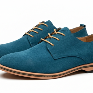 Zapato Derby de gamuza azul petróleo con cordones beige y suela de goma.