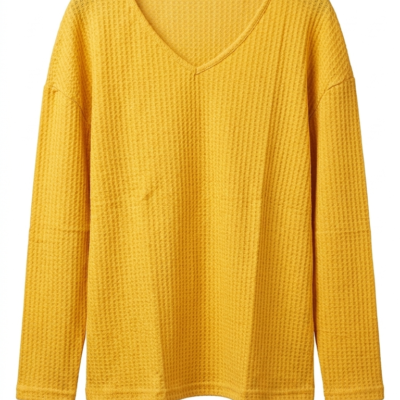 Jersey mostaza de punto gofrado con escote en V para mujer.